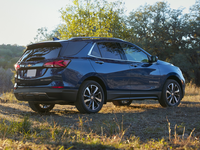 Rear view of Chevrolet Equinox L trim parked in a grassy field